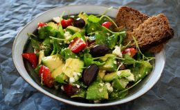 Delicious Greek salad featuring avocado, feta, and olives, ideal for a healthy meal.