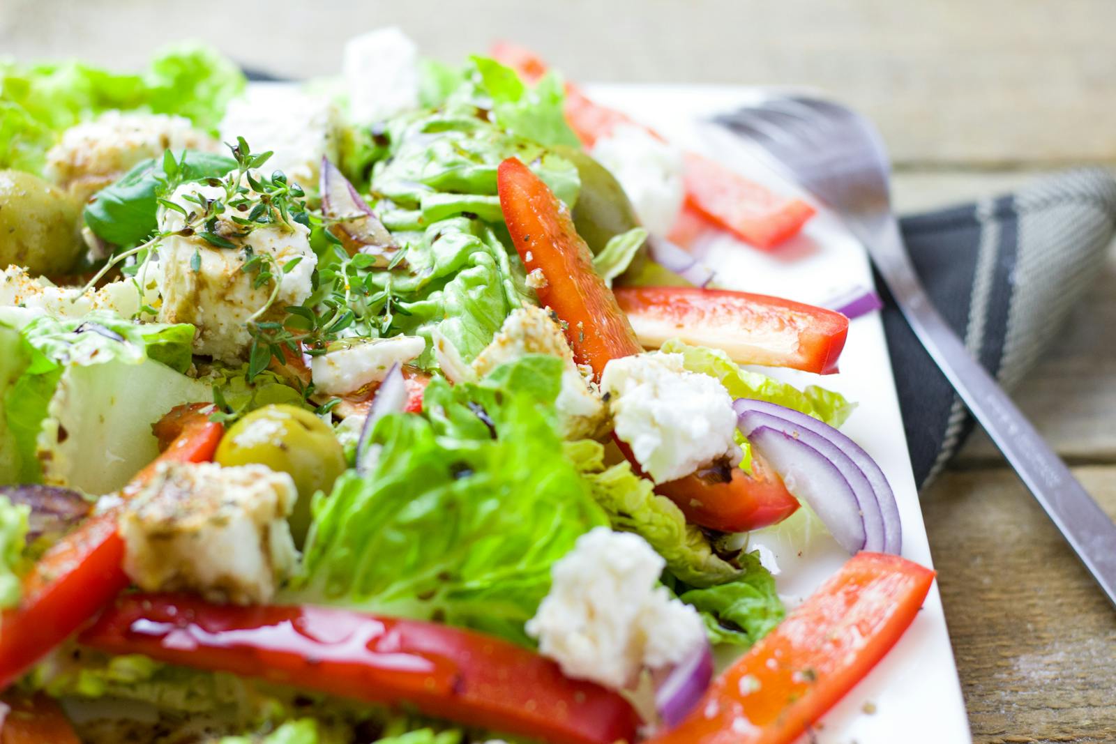 Colorful Greek salad with fresh vegetables and feta cheese.