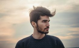 man wearing blue crew-neck top