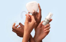 a group of people holding a white object in their hands